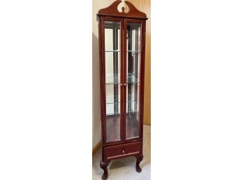 Vintage Hardwood Cherry Tone Curio Cabinet With Three Shelves And A Bottom Drawer