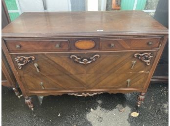 Four Drawer Wood Chest With Beautiful Detail And Hardware Pedestal Feet And Casters