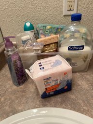 Tub Filled With Hand Soaps And Other Toiletries
