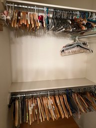 Closet Full Of Mostly Wooden Hangers