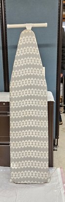 Lot 5-137  Ironing Board With Cover (behind Table)