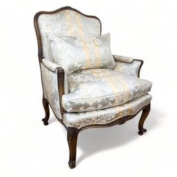 French Carved Arm Chair Upholstered In Satin Damask