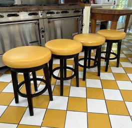 Four Swivel Stools With Mustard Yellow Seats