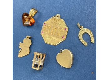 Five 14k Charms And A 14K Gold And Amber Heart Pendant