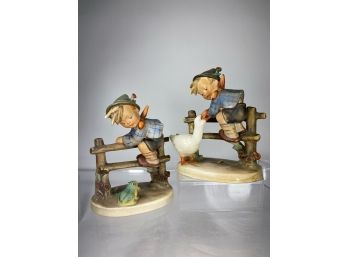Two M.J. Hummel Figures - Boys Scaling Over A Fence With Animals