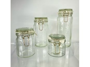 Four New, Clear Glass Canisters With Swing Lids