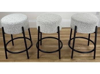 Three CB2 Stools Upholstered In White And Grey Boucle With Black Metal Bases