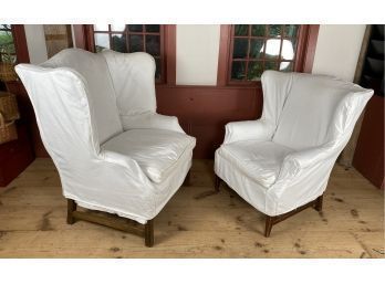 Two Classic Wingback Chairs Slipcovered In White