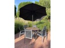 Gloster Teak Round Dining Table And 6 Chairs With Black Umbrella And Fabulous Concrete Stand