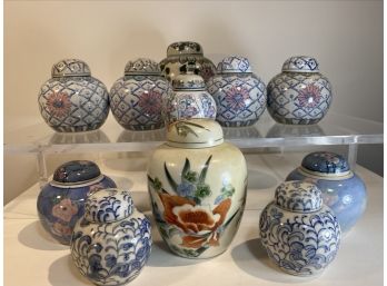 Eleven Ceramic Asian Lidded Jars In Various Sizes