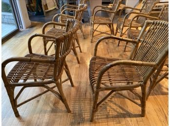 Eight Vintage Bent Wood Rattan Chairs