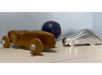 Two Adult Car Toys And A Blue Leather Baseball