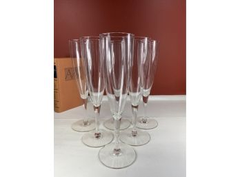 Six Vintage Perfectly Graduated Glass Champagne Flutes