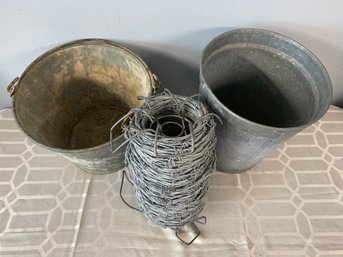 Galvanized Metal Buckets And Barbed Wire Skein