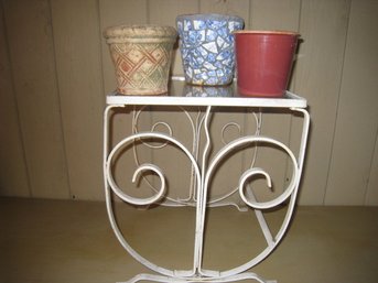 Wrought Iron Table With Glass Top And Three Colorful Pots