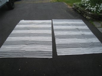 A Pair Of Grey And White Pier I Rugs