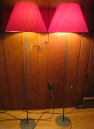A Pair Of Red Floor Lamps
