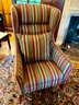 Wingback Sitting Chair In A Striped Pattern