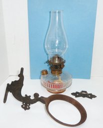 Antique Oil Lamp In Iron Bracket
