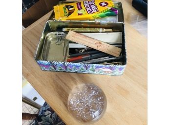 Paperweights, Pens And Other Office Supplies In A Tin Container
