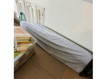 Ironing Board With Striped Cover (Upstairs Hallway)