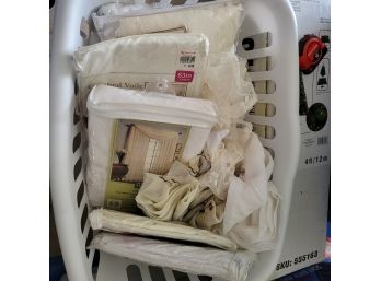 Laundry Basket Full Of New And Used Curtains And Valances