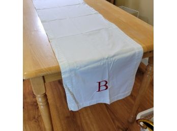 White Table Runner With Red Embroidered 'B'
