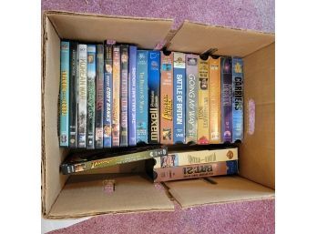 Box Of DVDs And VHS Tapes