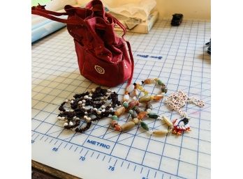 Leather Drawstring Bag With Beaded Necklaces
