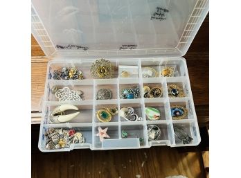 Plastic Divided Storage Bin With Mostly Broaches And Pendants