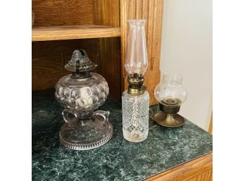 Two Oil Lamps And Candle Holder (Dining Room)