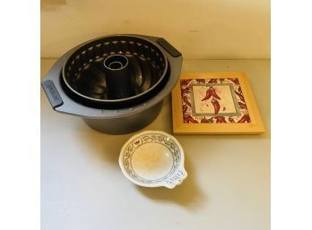 Assorted Kitchenware Lot - Bundt Pan, Chili Tile, And Ceramic Spoon Holder