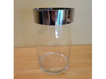 Circular Glass Vase With Silver Accent.