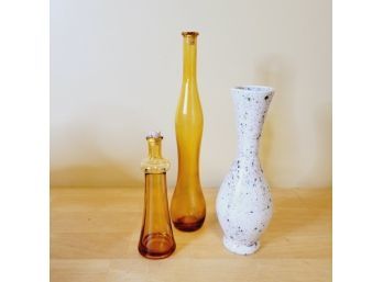 Yellow Glass Bottles And Speckled Vase
