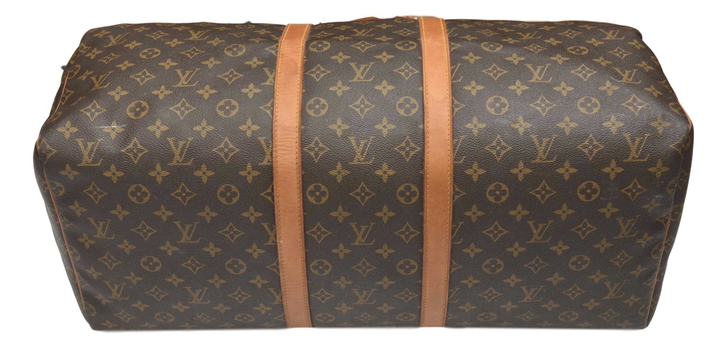 Sold at Auction: Louis Vuitton, Louis Vuitton Logo Story Keepall