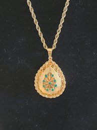 28' 14KT GOLD ROPE CHAIN AND 14KT PENDANT WITH 9 EMERALD CENTER STONES