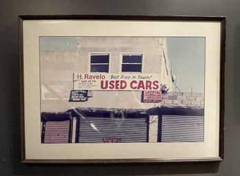 FRAMED PHOTOGRAPHIC PRINT OF NEW YORK USED AUTO SALES SHOP