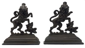 PAIR OF LION WITH ROSE CAST IRON ARMORIAL BOOKENDS