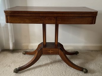 CLAWFOOT MAHOGANY CARD TABLE WITH LINED FOLDOVER SWIVEL TOP