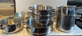 ASSORTED COLLECTION OF STAINLESS STEEL POTS AND PANS