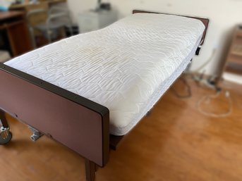 ELECTRIC HOSPITAL BED WITH GUARD RAILS AND ROLLING SERVING TRAY