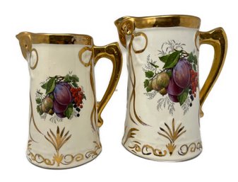 PR OF ENGLISH GOLD TRIM HAND PAINTED PORCELAIN PITCHERS