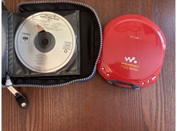 RED VINTAGE SONY CD WALKMAN INCLUDING  DISPLAYED CDS