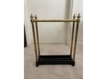 LATE VICTORIAN CAST IRON AND BRASS UMBRELLA STAND
