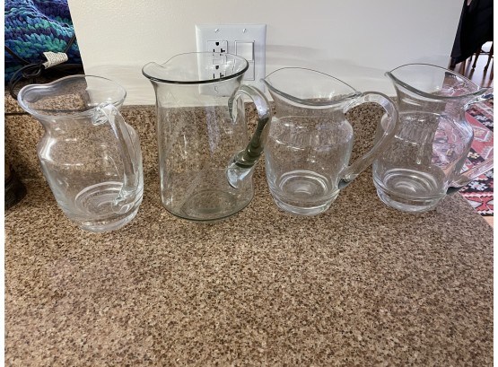 Set Of 4 Various Glass Pitchers