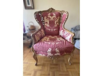 ANTIQUE WINGBACK UPHOLSTERED ARMCHAIR