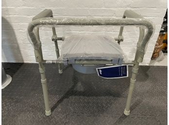 NEW UNUSED ADJUSTABLE FOLDING COMMODE BY DRIVE