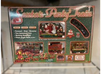 VINTAGE 'SANTA'S PARTY TRAIN' MUSICAL, LIGHTING AND MOVING TRAIN SET