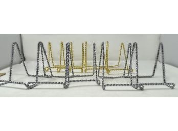 COLLECTION OF SILVER AND GOLDTONE TWISTED METAL EASELS