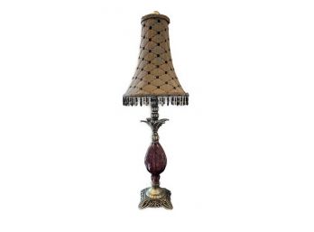 AMETHYST COLORED GLASS AND BRASS TABLE LAMP WITH BEADED, FRINGED SHADE